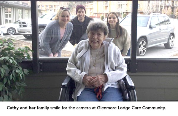 Cathy and her family smile for the camera at Glenmore Lodge Care Community.