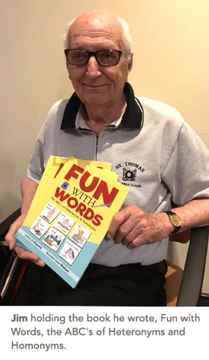 Jim holding the book he wrote, Fun with Words, the ABC's of Heteronyms and Homonyms.