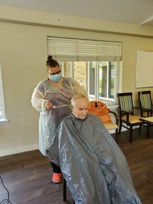 image of Diane giving a resident haircut