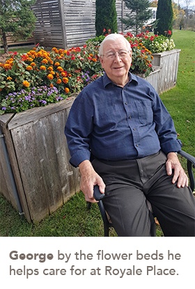 picture of George by the flower beds