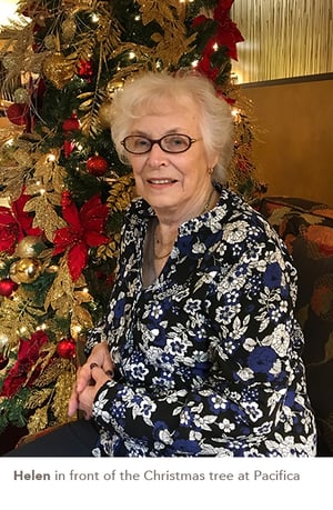 Helen in front of the Christmas tree at Pacifica