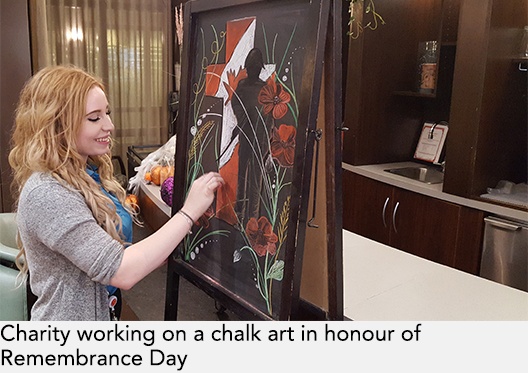 Charity working on a chalk art in honour of Remembrance Day