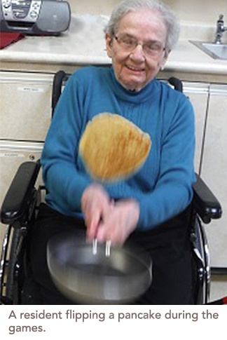 A resident flipping a pancake during the games