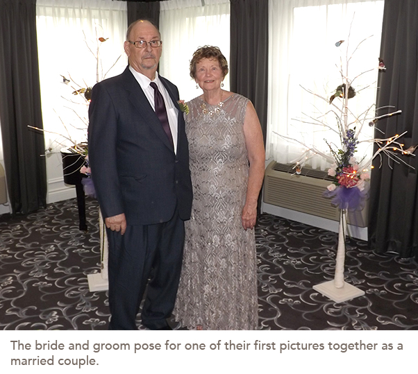 The bride and groom pose for one of their first pictures together as a married couple.