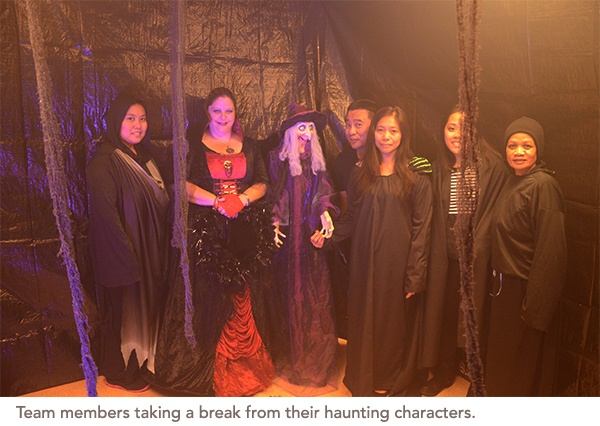 Team members taking a break from their haunting characters